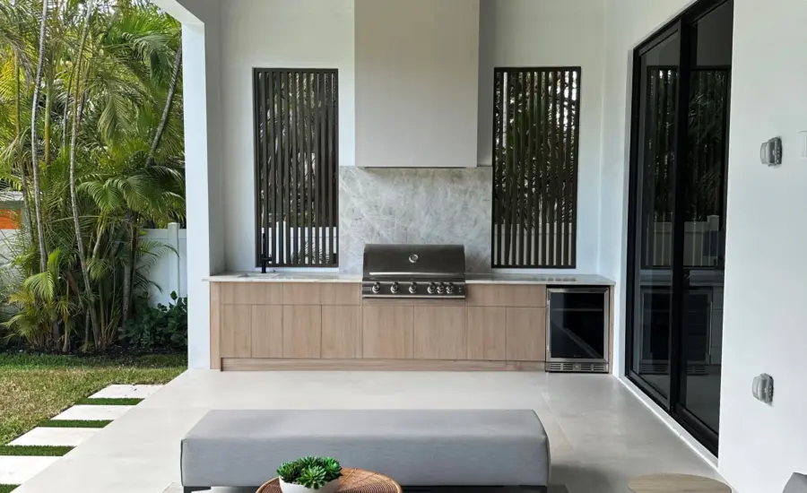 Covered patio outdoor kitchen with LIOHER weatherproof cabinetry, grill and beverage center