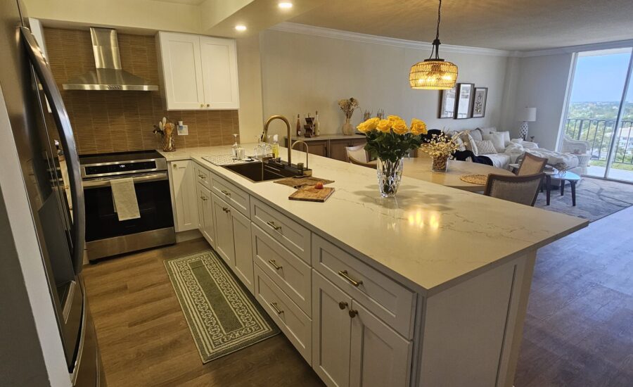 White shaker kitchen remodel with quartz island by Dreamery, South Florida